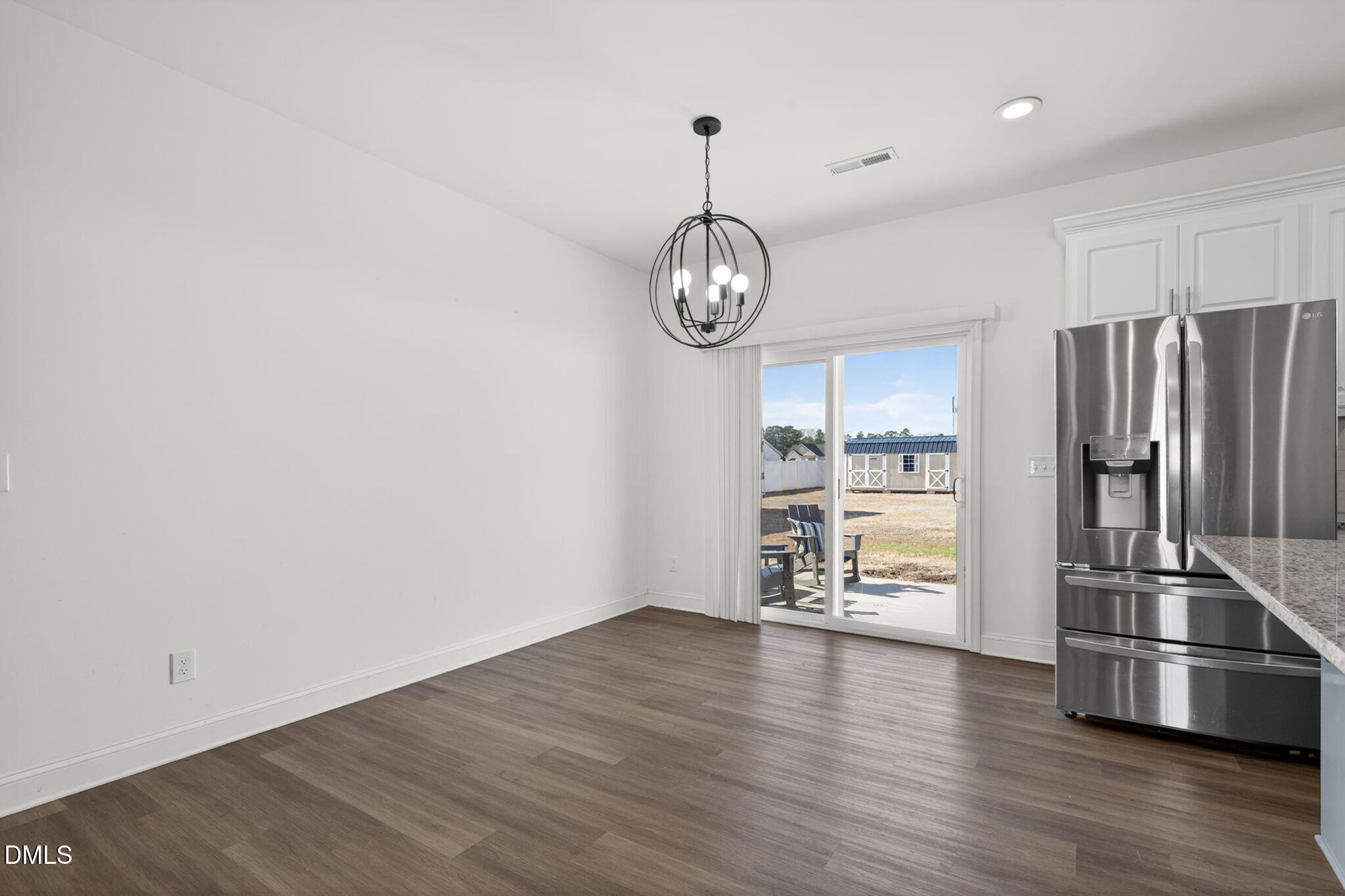 9084 Byron Court Bailey, NC 27807 - Photo 14 of 40 a view of a kitchen with wooden floor and stainless steel appliances