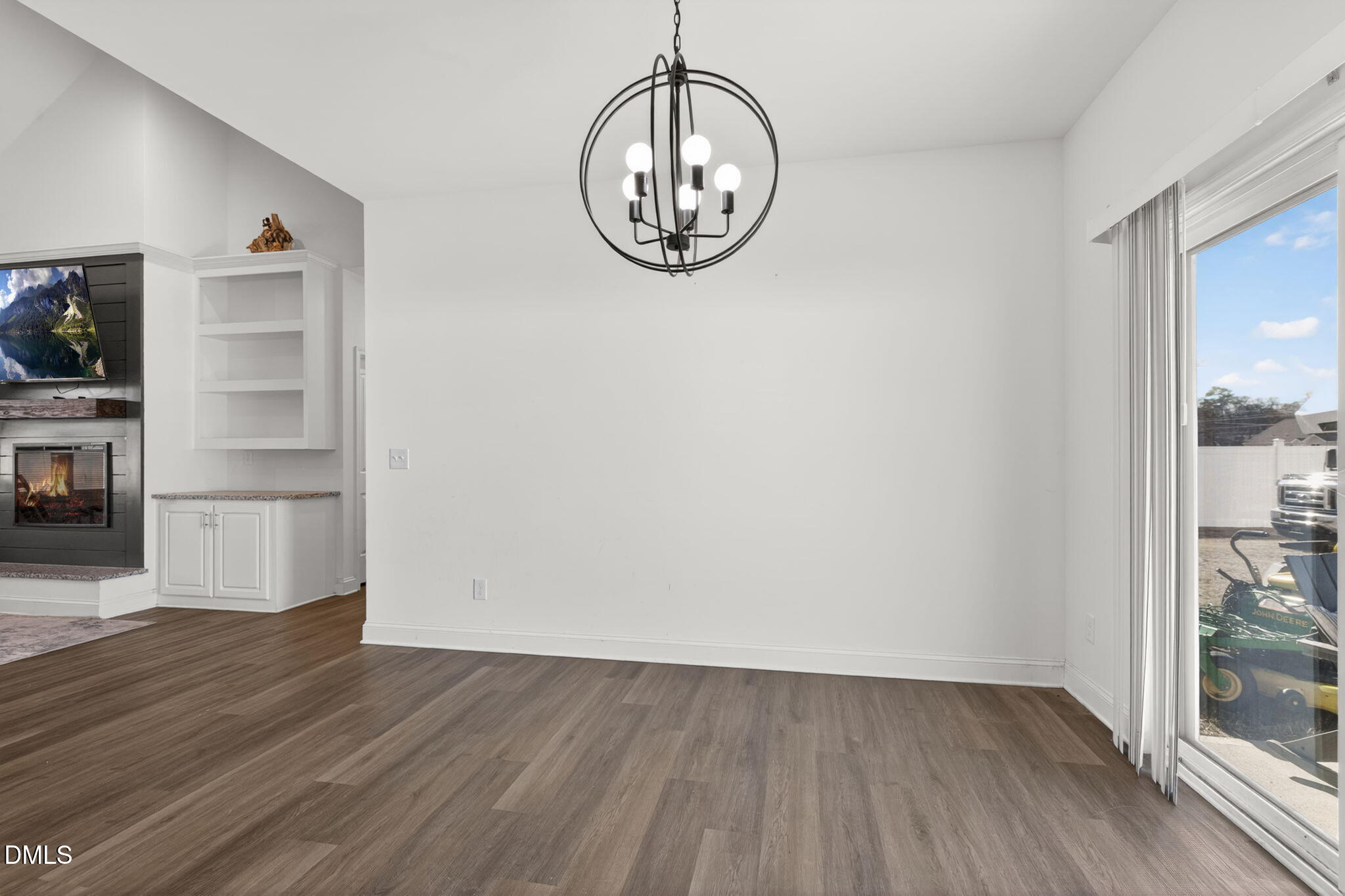 9084 Byron Court Bailey, NC 27807 - Photo 15 of 40 a view of empty room with wooden floor and fan
