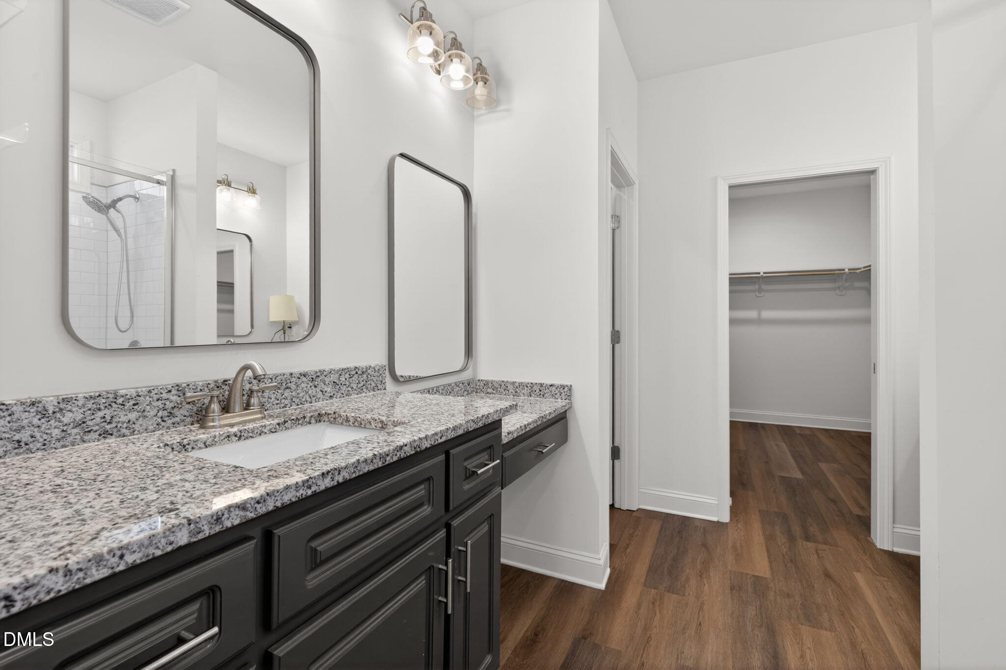 9084 Byron Court Bailey, NC 27807 - Photo 19 of 40 a bathroom with a granite countertop sink and a mirror