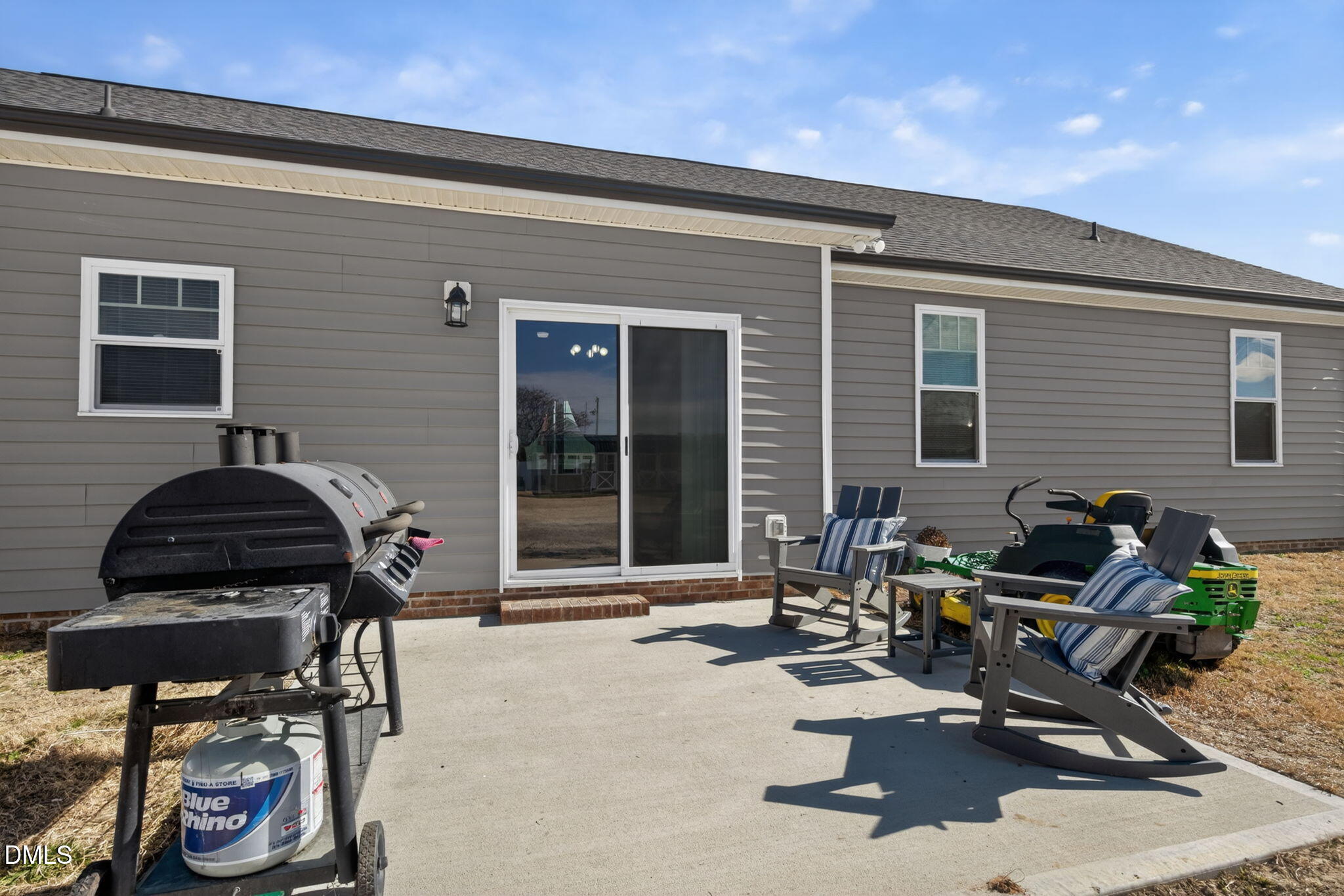 9084 Byron Court Bailey, NC 27807 - Photo 32 of 40 a view of a patio with table and chairs and potted plants