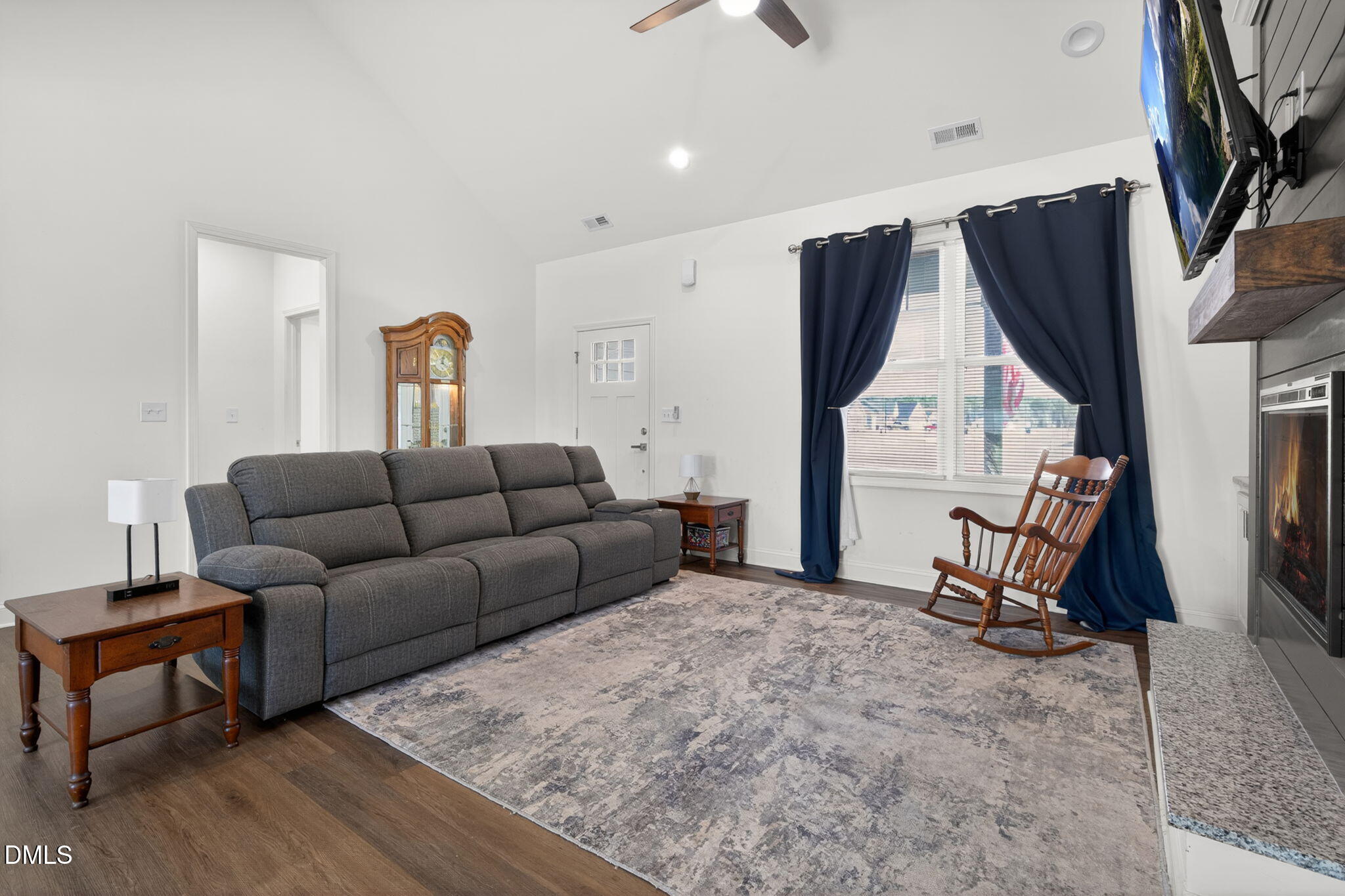 9084 Byron Court Bailey, NC 27807 - Photo 7 of 40 a living room with furniture a couch and a flat screen tv