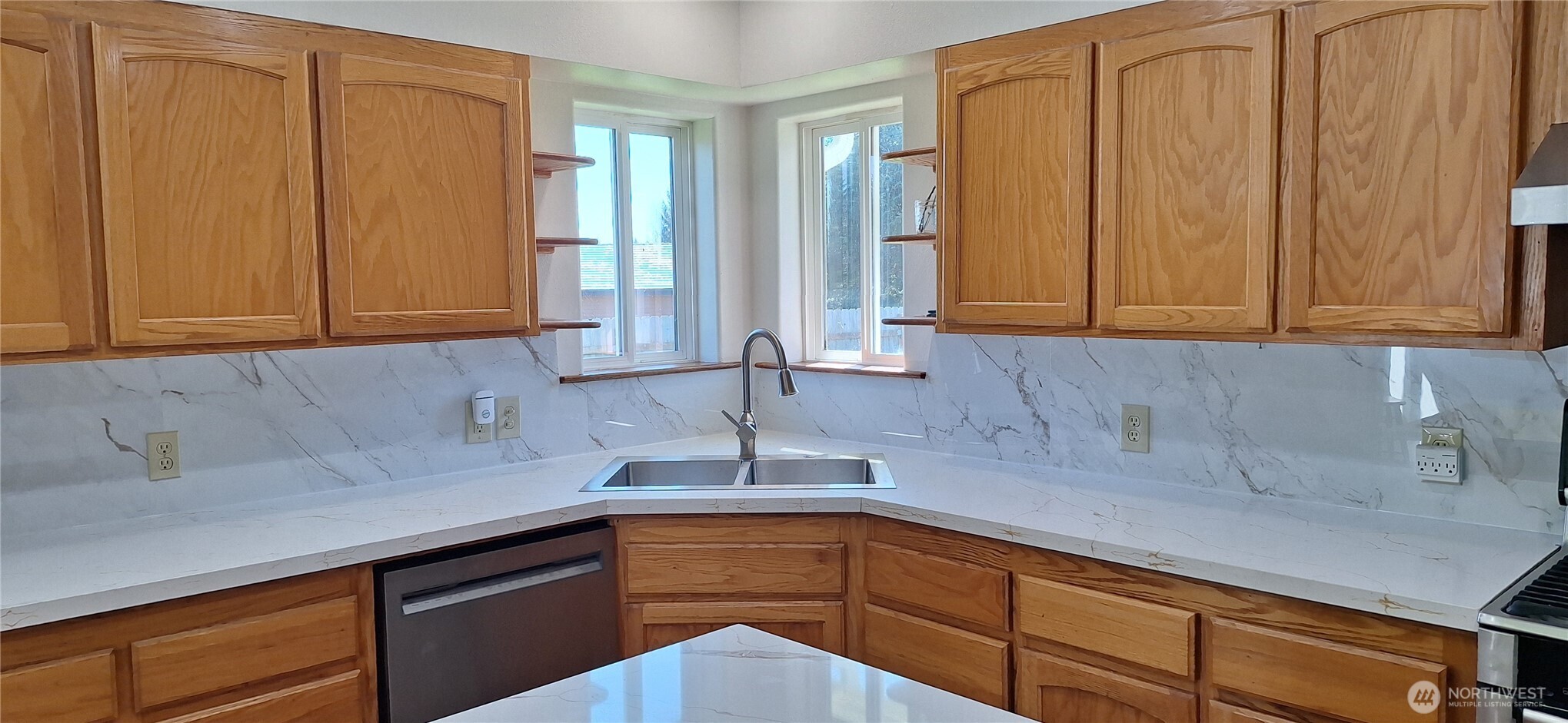 10 Spruce South Bend, WA 98586 - Photo 13 of 29 a kitchen with stainless steel appliances granite countertop white cabinets a sink and dishwasher