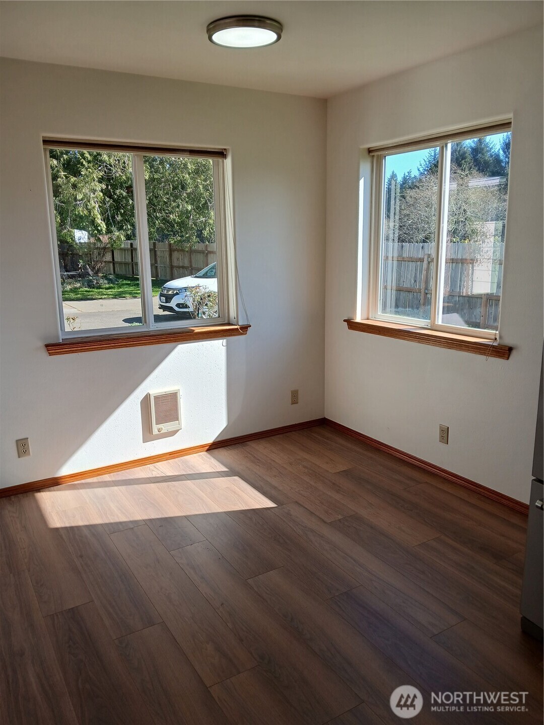10 Spruce South Bend, WA 98586 - Photo 18 of 29 a view of an empty room with wooden floor and a window