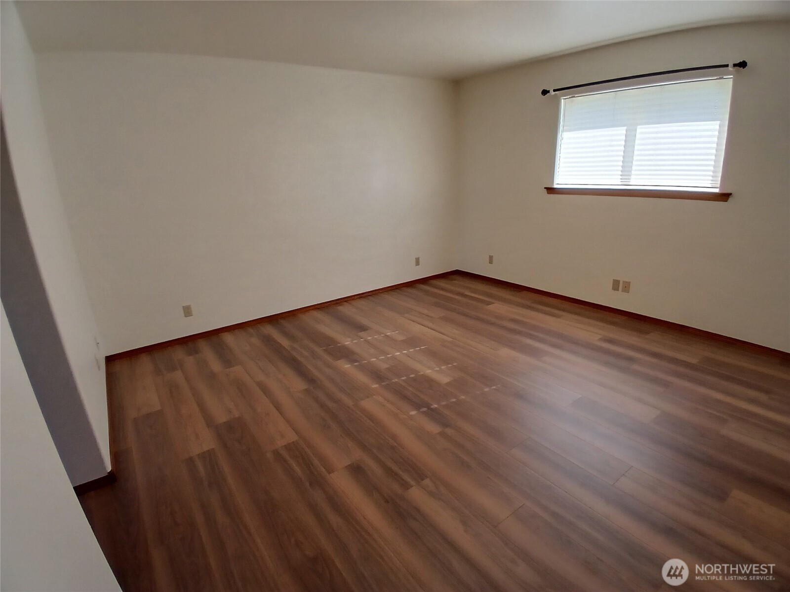 10 Spruce South Bend, WA 98586 - Photo 20 of 29 an empty room with wooden floor and windows