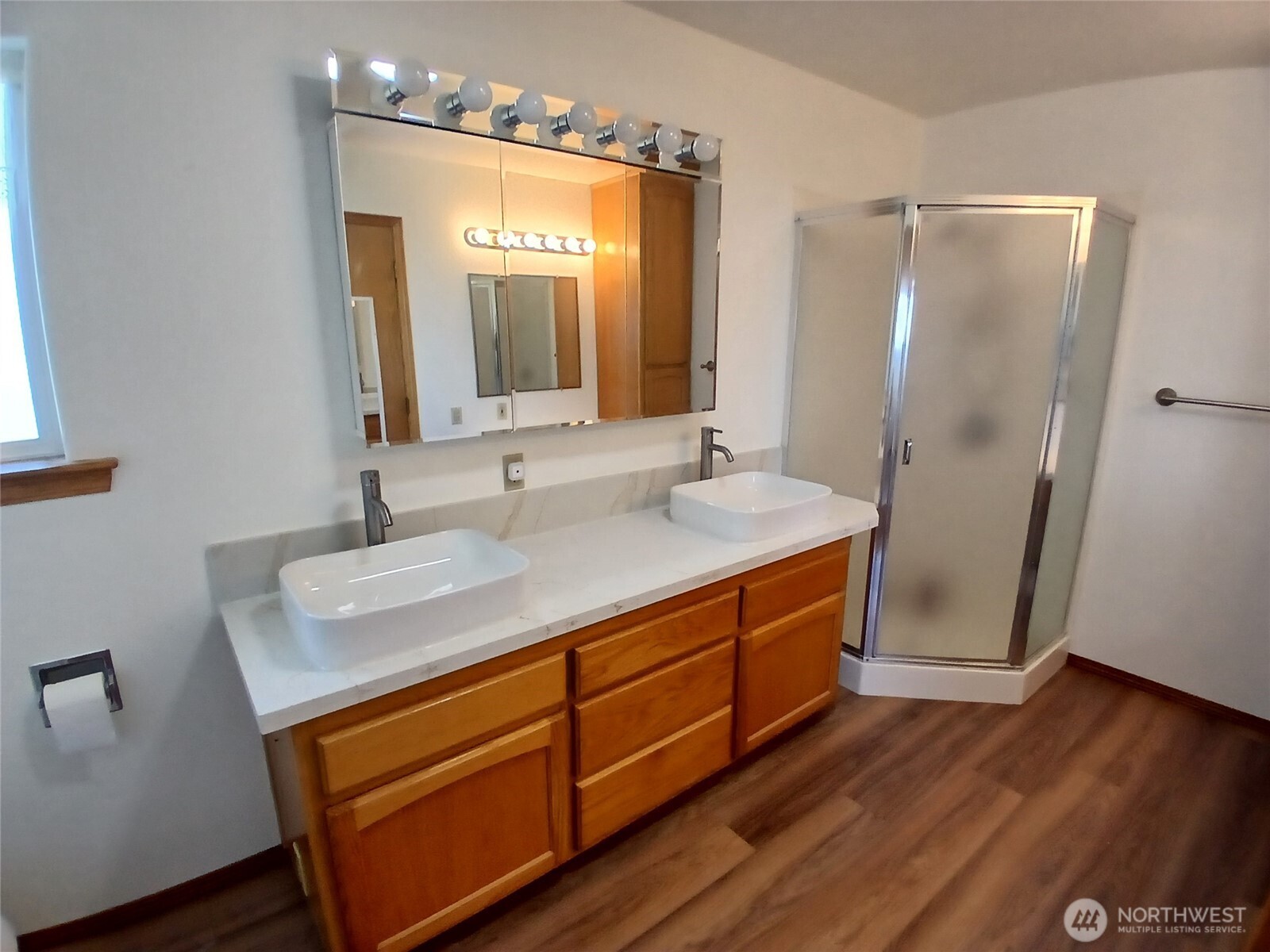 10 Spruce South Bend, WA 98586 - Photo 23 of 29 a bathroom with a sink a mirror and a shower