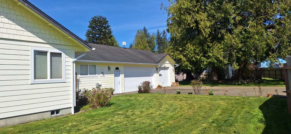 10 Spruce South Bend, WA 98586 - Photo 3 of 29 a view of a house with backyard and a tree