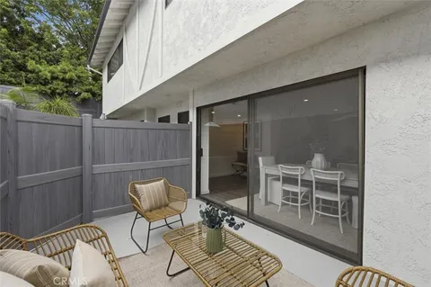a kitchen with stainless steel appliances a sink cabinets and a refrigerator