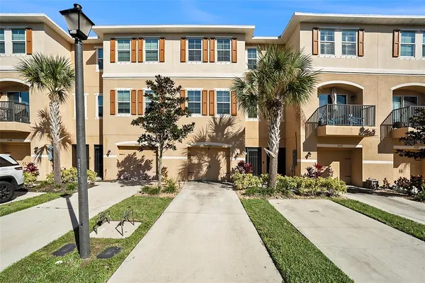 a front view of a building with many windows