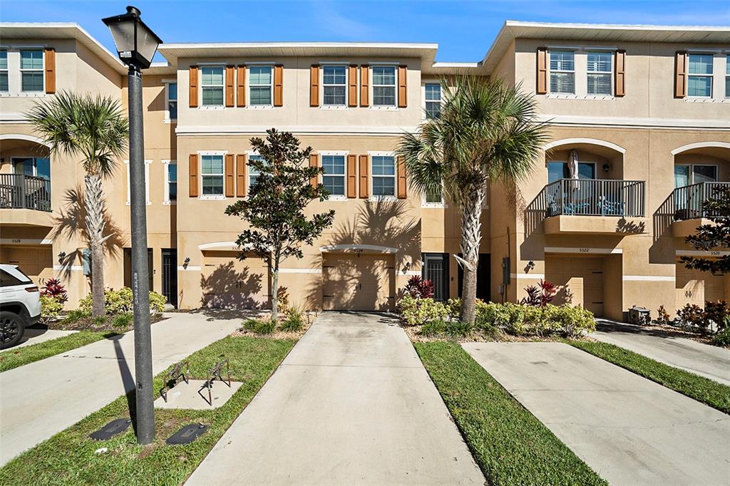 a front view of a building with many windows