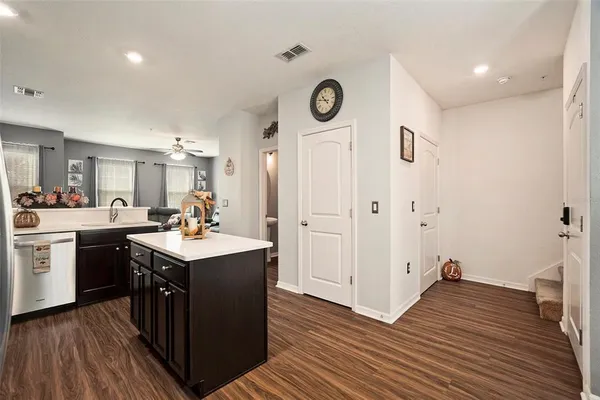 a kitchen with a sink and a stove top oven