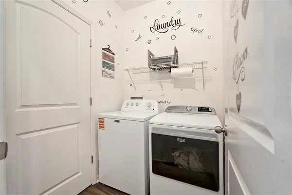 a utility room with dryer and washer