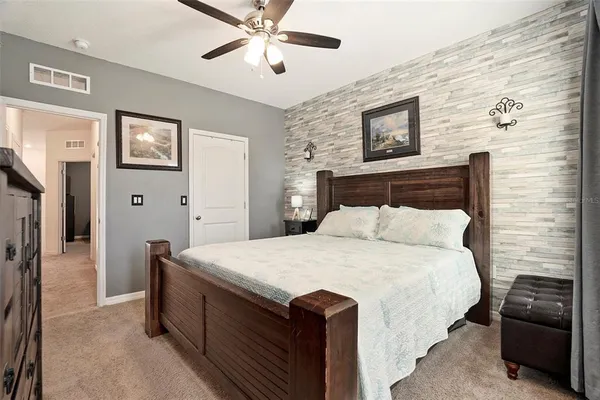 a bedroom with a bed and a tv