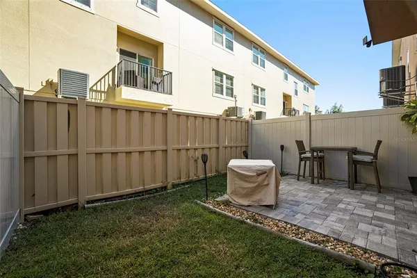a view of a backyard with furniture