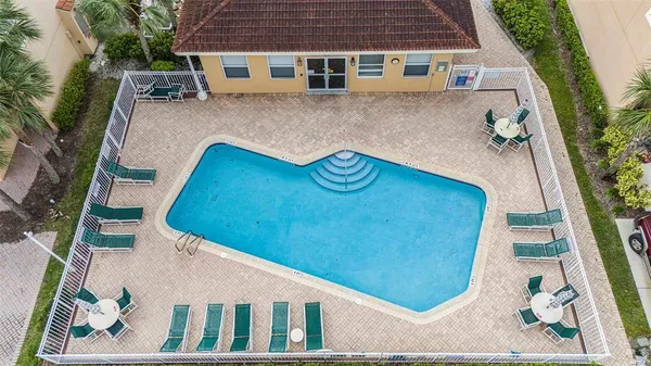 an aerial view of a house with a swimming pool