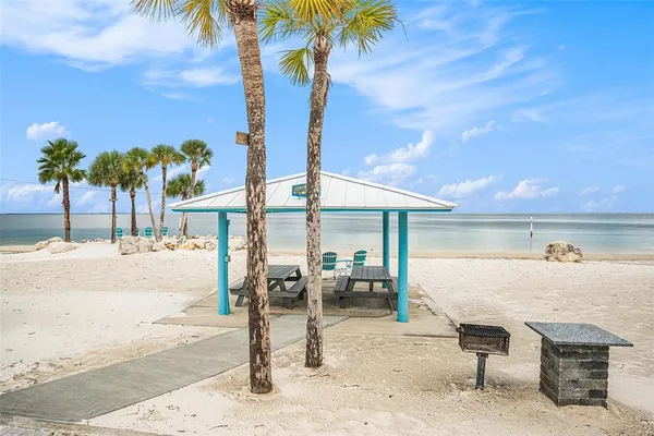 a view of a patio with a table and chairs