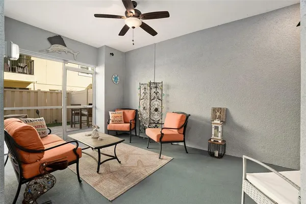 a living room with furniture and a window