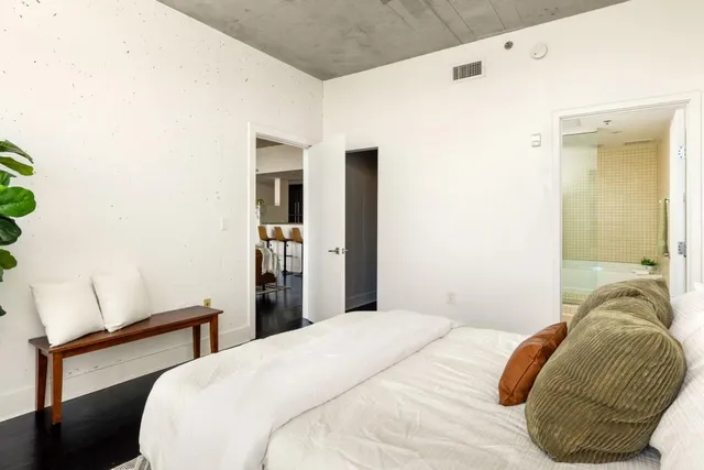 a view of walk in closet with empty racks