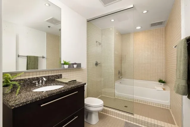 a bathroom with a bathtub and a shower