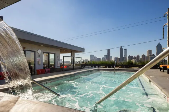 a view of a swimming pool with sitting area