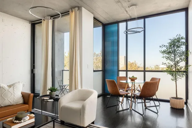 a dining room with furniture and wooden floor