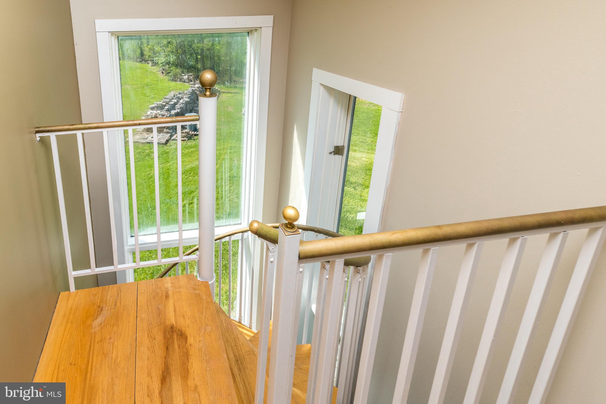 440 Sturgis Road Harleysville, PA 19438 - Photo 43 of 51 Spiral stair case leading to living room