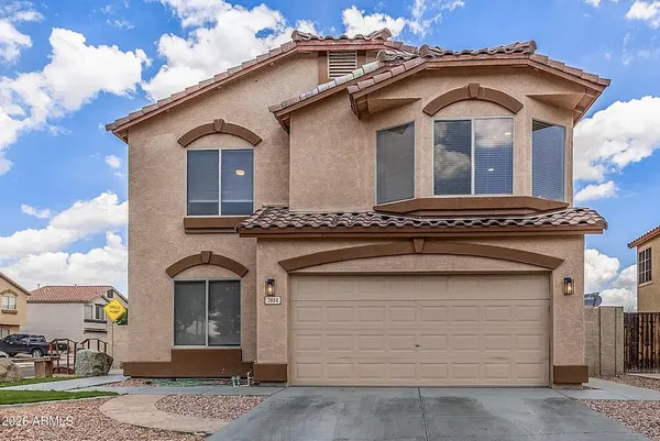 a view of a white house with a outdoor space