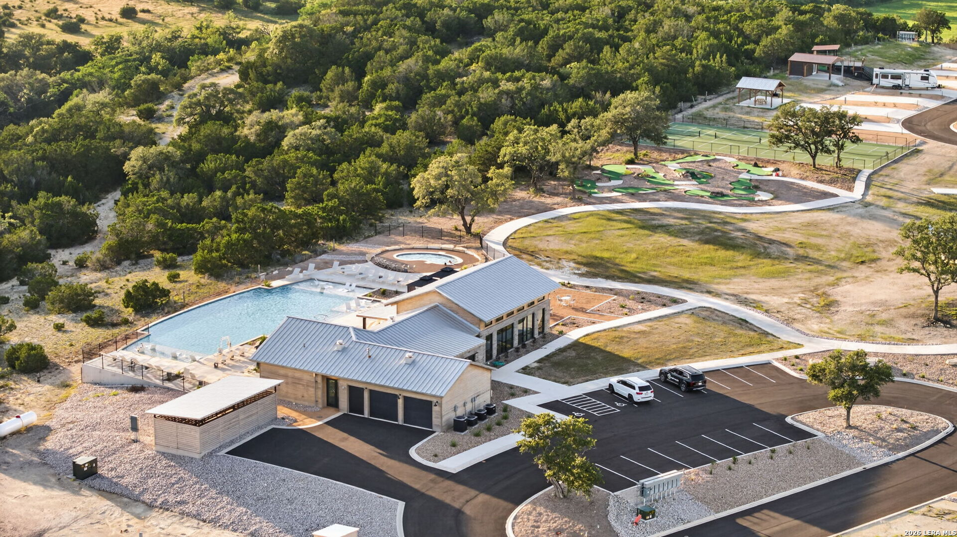 5386 Ranch Road 1376, Unit 64 Fredericksburg, TX 78624 - Photo 35 of 45 an aerial view of residential houses with outdoor space