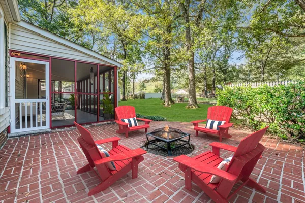 a view of a backyard with sitting area