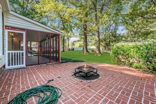 a view of a backyard with sitting area