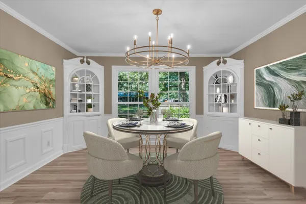 a dining room with furniture a chandelier and wooden floor