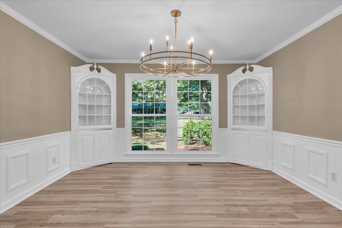 302 Marbeth Lane Tullahoma, TN 37388 - Photo 23 of 50 a view of an empty room with wooden floor and a window