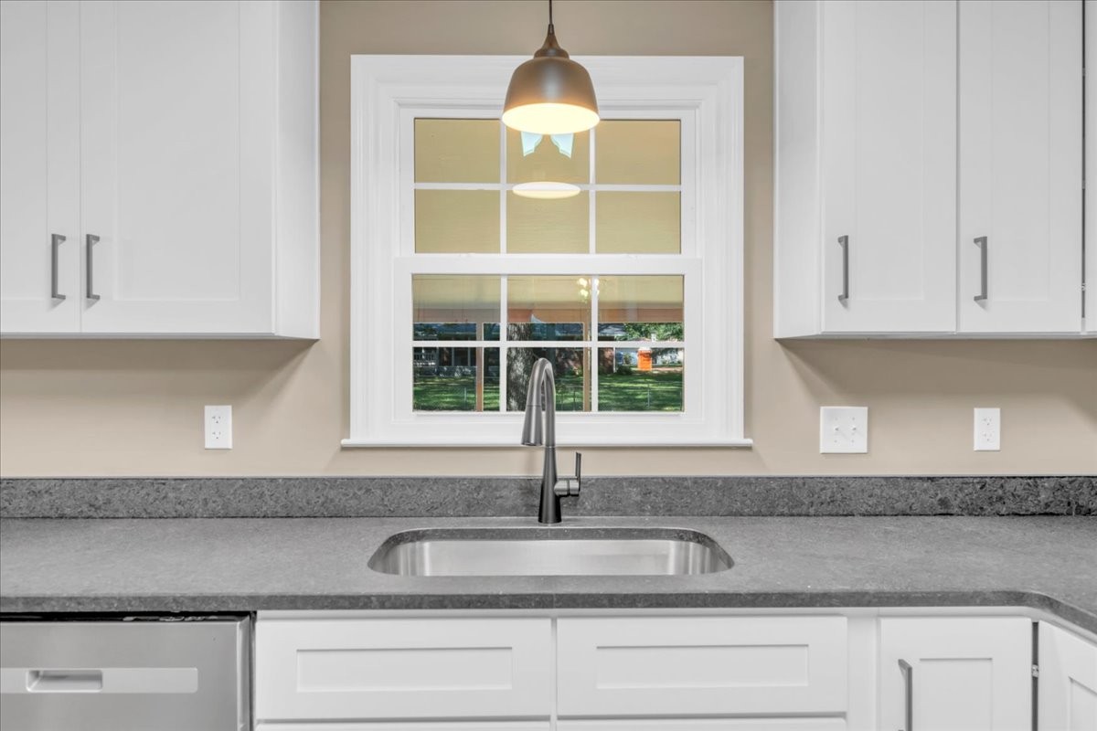 302 Marbeth Lane Tullahoma, TN 37388 - Photo 27 of 50 a kitchen with granite countertop a sink and cabinets