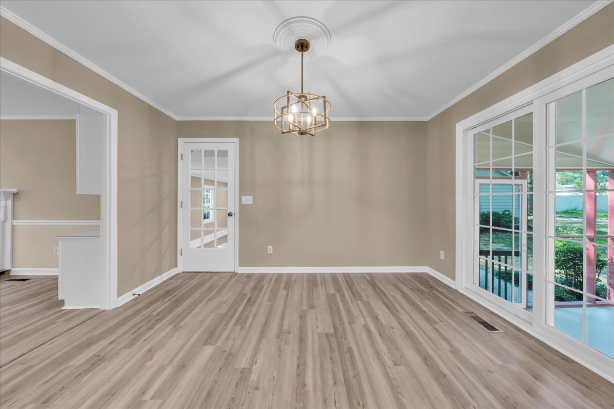 302 Marbeth Lane Tullahoma, TN 37388 - Photo 29 of 50 a view of a room with wooden floor chandeliers and kitchen view