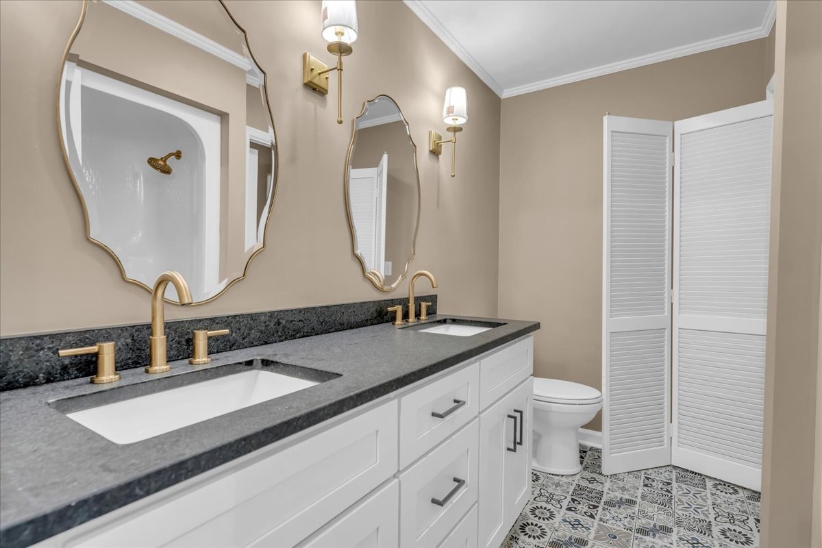 302 Marbeth Lane Tullahoma, TN 37388 - Photo 36 of 50 a bathroom with a double vanity sink and a mirror