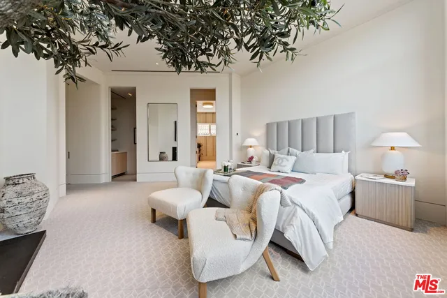 a view of walk in closet and window