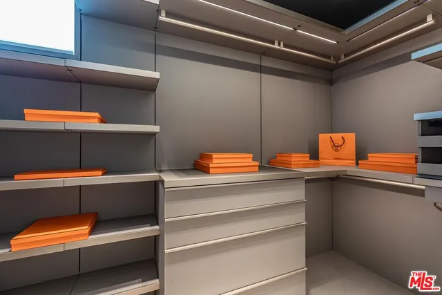 a bedroom with a bed and a potted plant