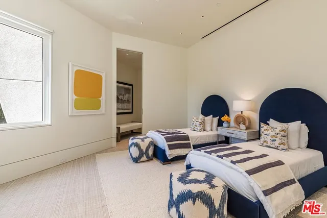 a table and chairs in front of a window