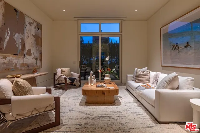 a kitchen with a sink a stove and cabinets