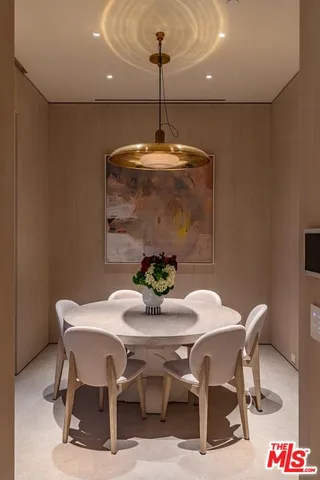 a kitchen with stainless steel appliances kitchen island granite countertop a sink and cabinets