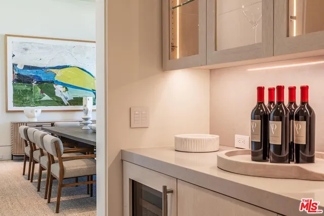 a view of a roof deck with a couches and potted plants