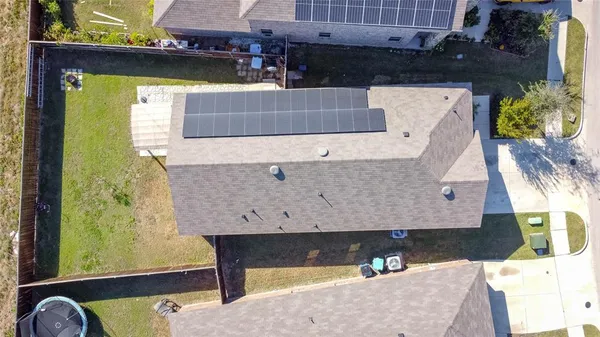 an aerial view of a house with swimming pool