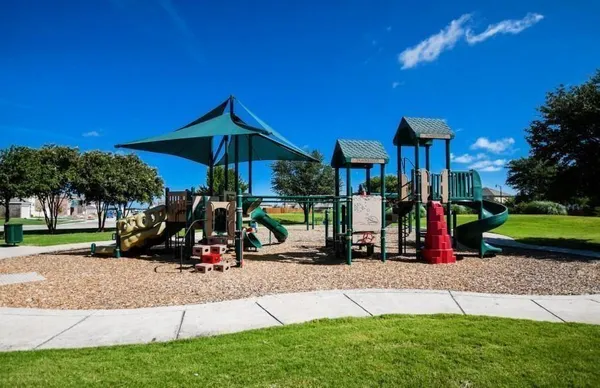 a view of a park with swings