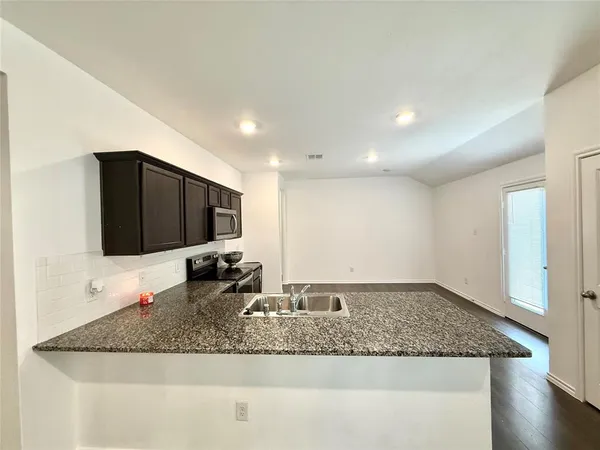 a view of a large kitchen island