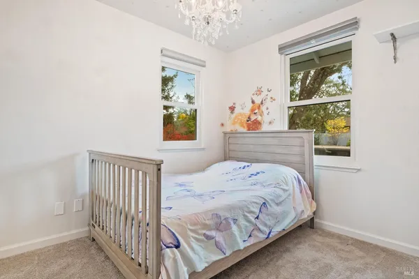 a bedroom with bed and a window