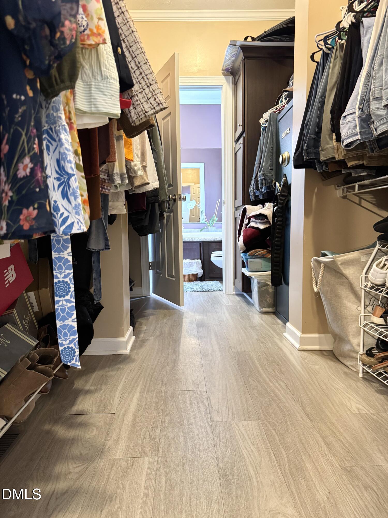 640 Tart Town Road Dunn, NC 28334 - Photo 37 of 71 a view of walk in closet with clothes and shoes
