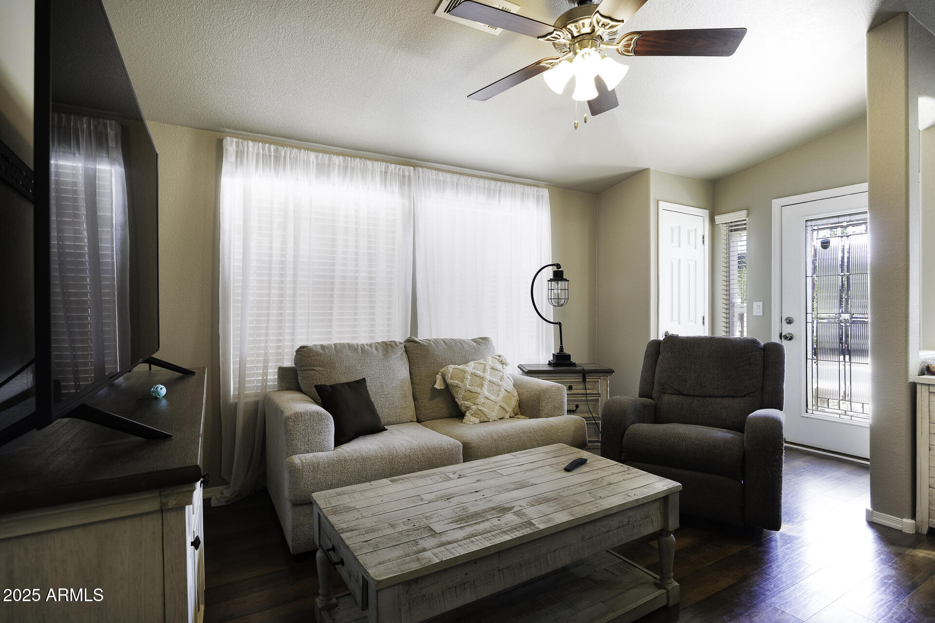 1110 North Henness Road, Unit 1351 Casa Grande, AZ 85122 - Photo 14 of 62 a living room with furniture and a flat screen tv