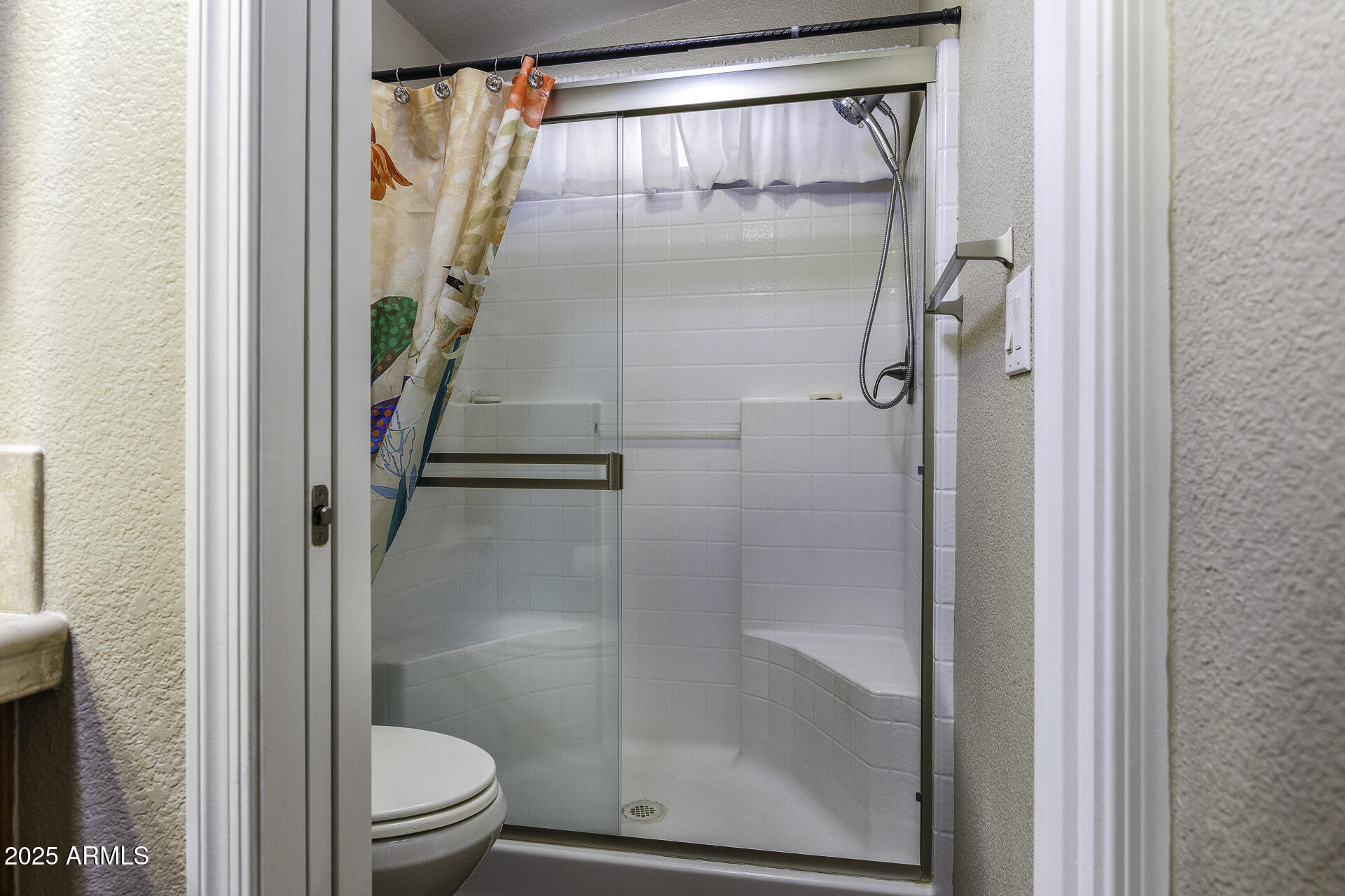 1110 North Henness Road, Unit 1351 Casa Grande, AZ 85122 - Photo 19 of 62 a bathroom with a glass shower door