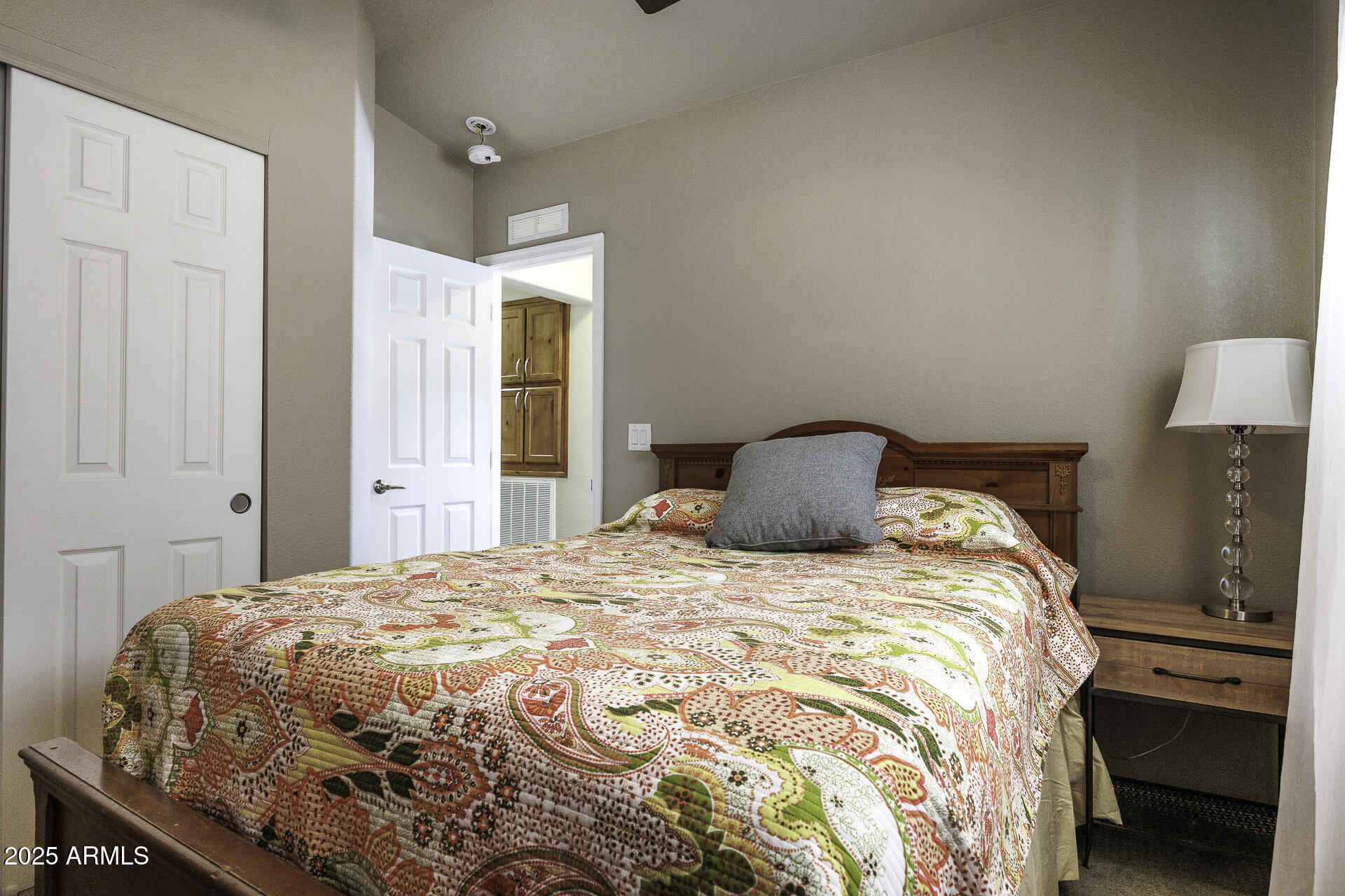 1110 North Henness Road, Unit 1351 Casa Grande, AZ 85122 - Photo 21 of 62 a bedroom with a bed and a window