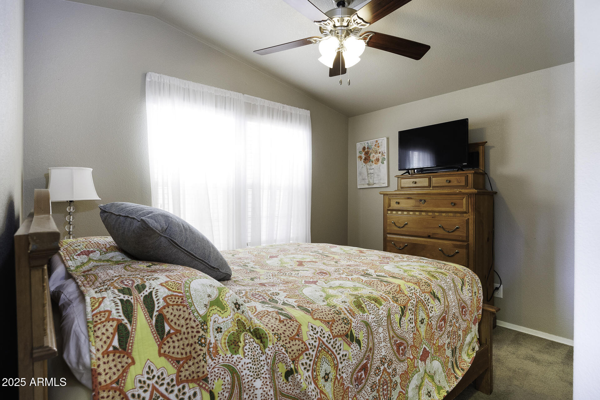 1110 North Henness Road, Unit 1351 Casa Grande, AZ 85122 - Photo 22 of 62 a bedroom with a bed and a flat screen tv