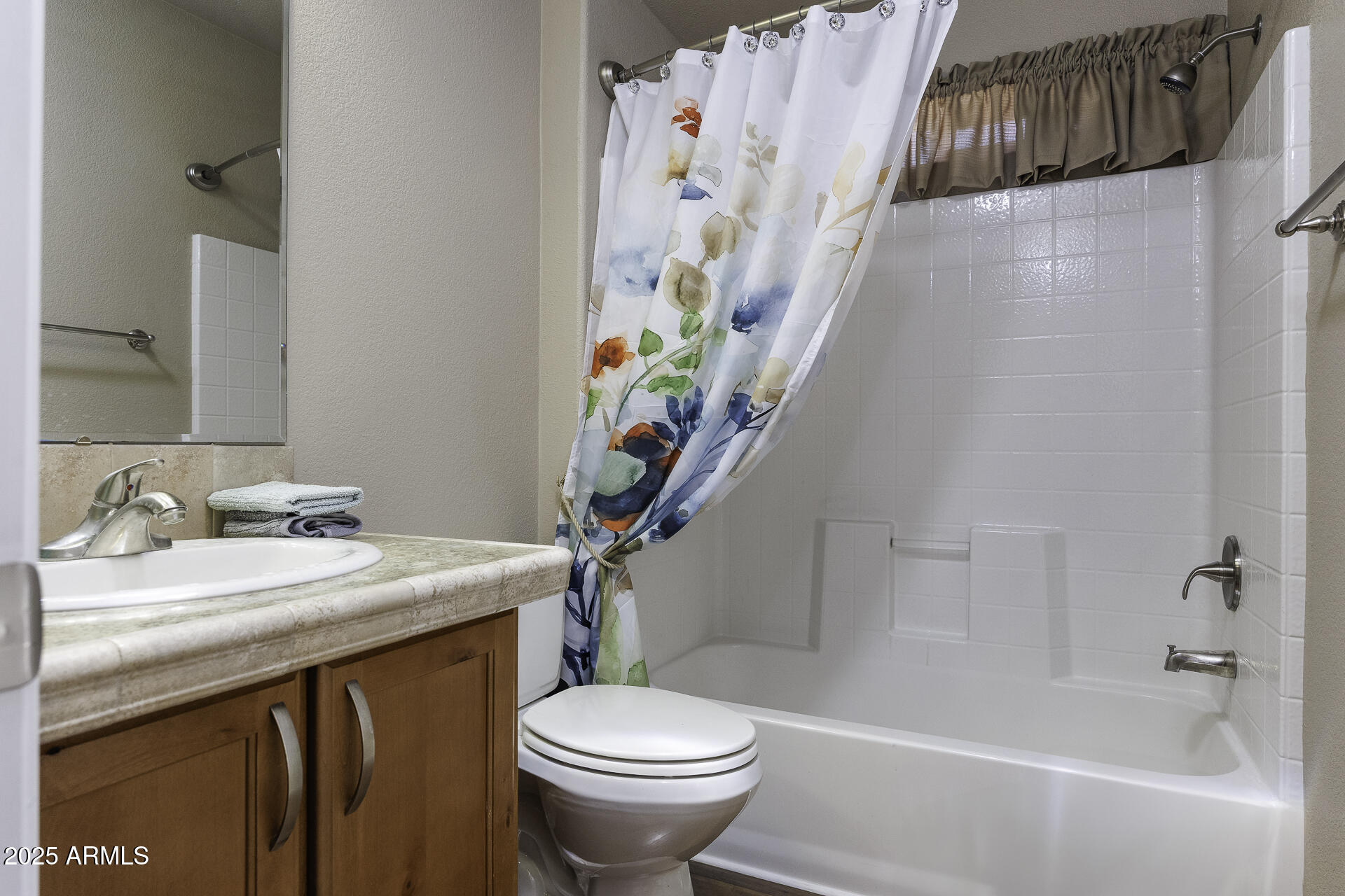 1110 North Henness Road, Unit 1351 Casa Grande, AZ 85122 - Photo 23 of 62 a bathroom with a sink a toilet and a bathtub